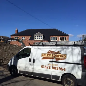 Allen Roofing van outside a completed roof – emergency roof repairs Lincoln