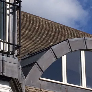 Lead-clad arched dormer on a period property – leadwork Lincoln