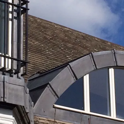 Lead-clad arched dormer on a period property – leadwork Lincoln