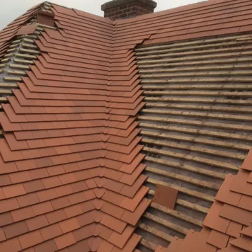 New clay tile roof with hips being completed – new roofing Lincoln