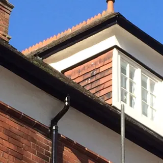 Tiled dormer with new guttering after roof repairs in Lincoln