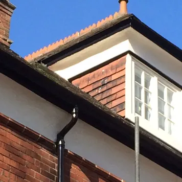Tiled dormer with new guttering after roof repairs in Lincoln