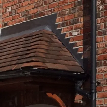 Repaired tiled bay roof with lead soakers in Lincolnshire