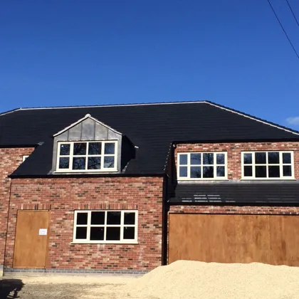 New build house roofed by Allen Roofing, one of the established roofing companies in Lincoln