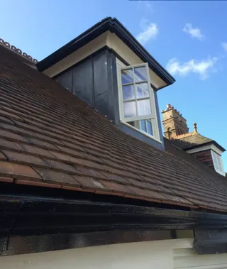Tiled roof with lead-clad dormer and new fascia in Lincoln