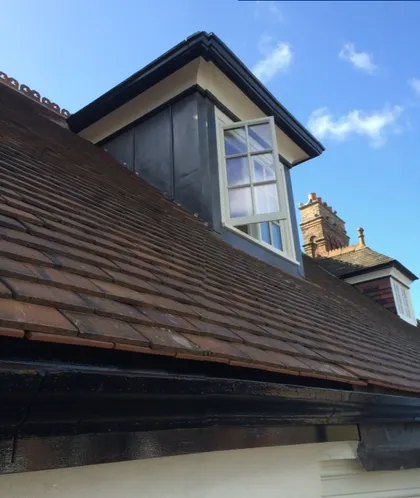 Tiled roof with lead-clad dormer and new fascia in Lincoln
